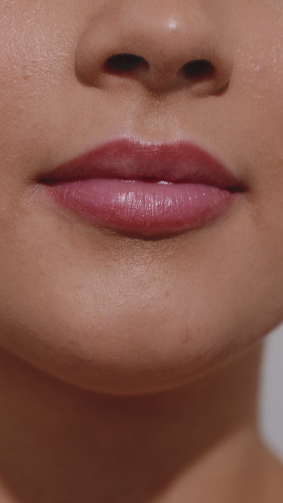 Girl applying espresso martin colour lip gloss